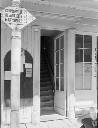 CSAA Camptonville, Nevada City, Marysville mileage sign on the front of the St. Charles Hotel in Downieville, California